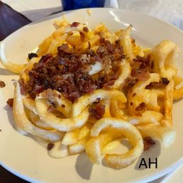 Baumhower's Victory Grille signature dishes "Legendary" Wings, Gooey Fries, Pot Roast, Baumhower's Burger